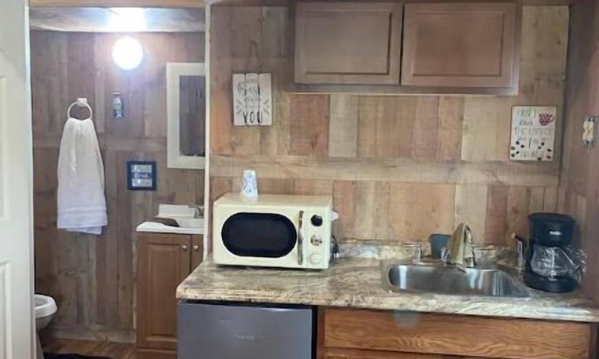 Smith County House | Delightful kitchenette style tiny home with loft.