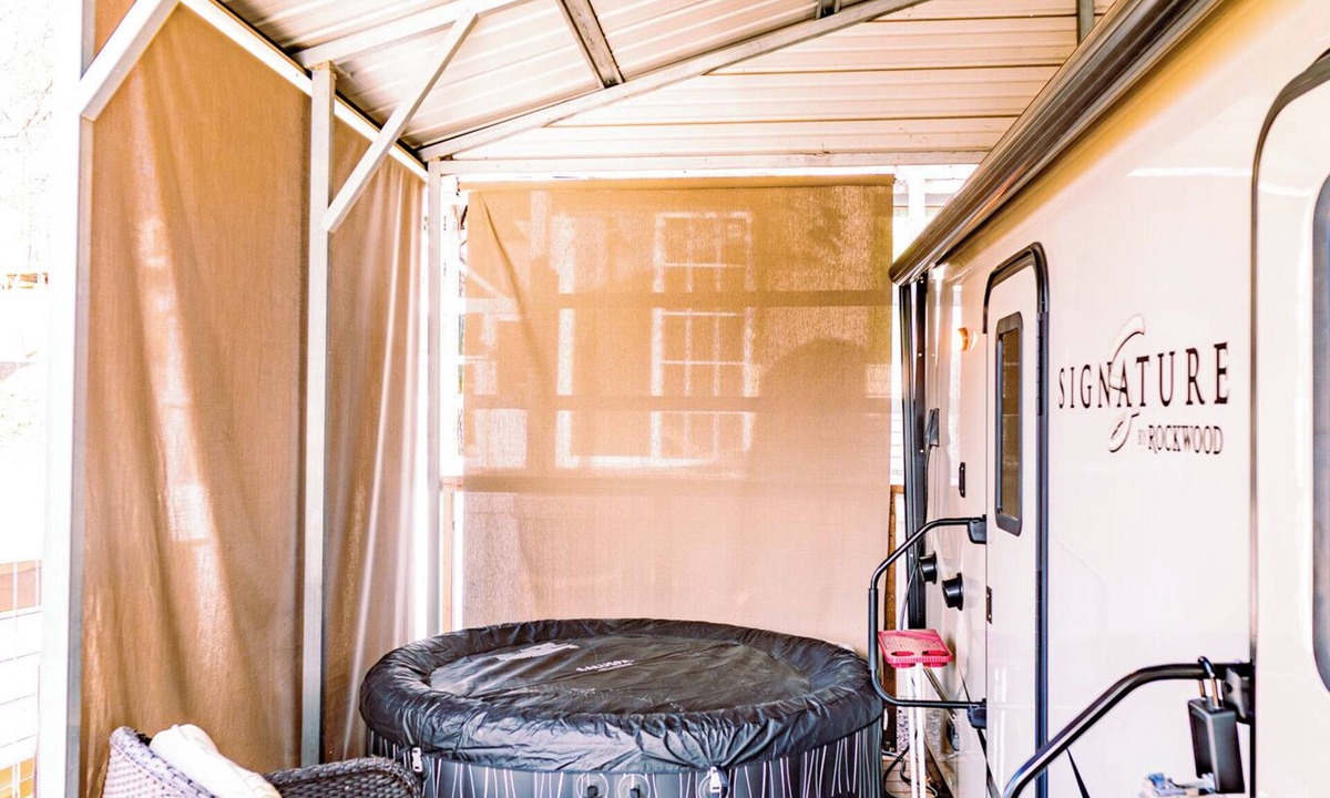 Dandridge RV Rental | Gorgeous Modern Camper located on Lake Douglas with Hot Tub!