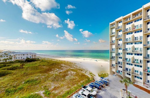 Sunnyside House | Beachfront condo in gated resort with pools lake access fast WiFi & patio