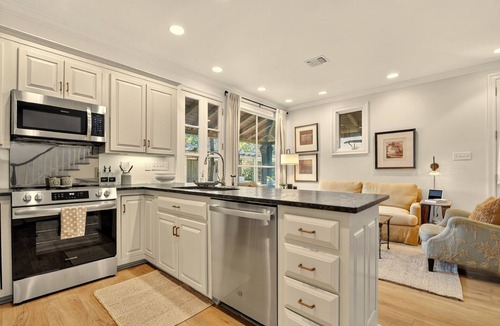 Bayou View Cottage | Beautiful two story cottage on a private, wooded street but close to everything!