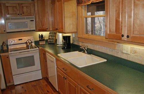 Seven Devils Cabin | Book your Fall Getaway! Firepit. Pond view. Wood burning fireplace.