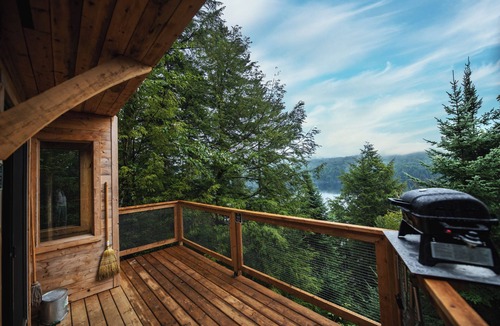 Saint-Faustin-Lac-Carre House | Cliffside treehouse, upper floor bedroom, lake view | Lodging #17