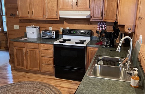 Tuckasegee House | Cozy, 4 front porch rocking chairs, porch swing, picnic shelter, outdoor fire.