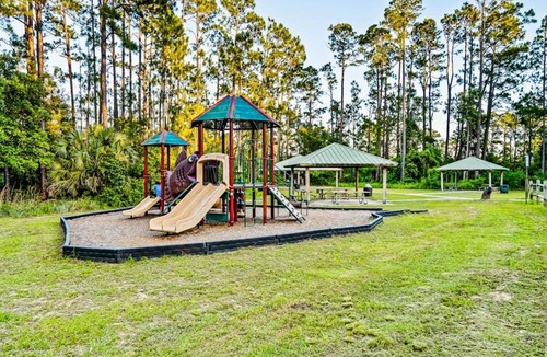 Perdido Bay Villas House | Dog friendly coastal townhome with golf course views patios and washer dryer