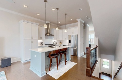 Hitch Village - Fred Wessels Homes House | Dog-friendly townhouse with modern kitchen, balcony, garden tub, & central AC