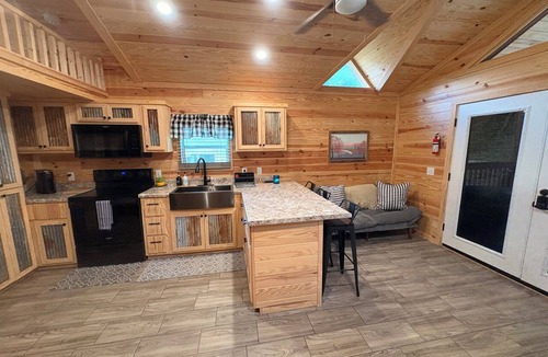 Waynesville Cabin | Escape to the beauty of the mountains in this cozy 2-bedroom tiny home.