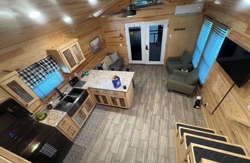Waynesville Cabin | Escape to the beauty of the mountains in this cozy 2-bedroom tiny home.