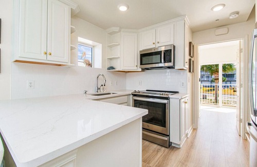 Villa Sabine Townhouses Villa | Fully renovated waterfront townhome with kayak, SUP, bikes, wagon, chairs, tent!