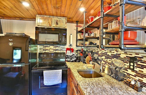 Clyde House | Glamping Caboose Rental Perfect for Families near Clyde, North Carolina
