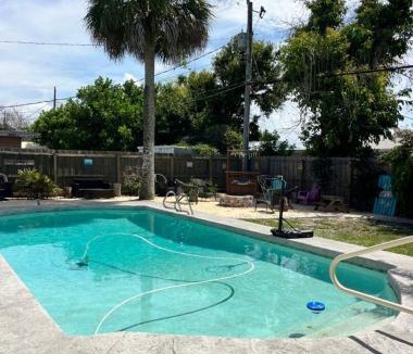 Interchange Square Apartment | Gorgeous four bedroom pool home in Palm Bay