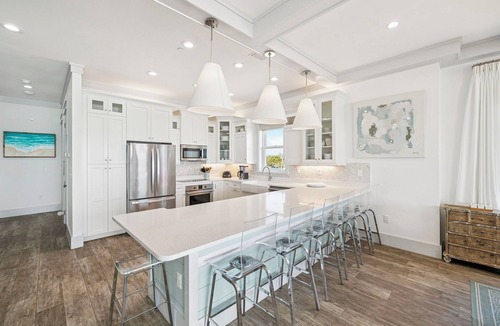 Sunnyside House | Gulf front retreat with pool, hot tub, & beach service—perfect for family groups