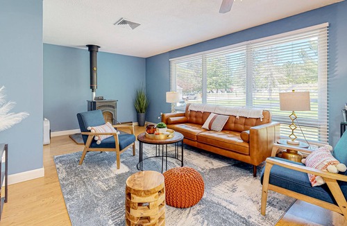 Barnstead House | Inviting riverfront home with pool, kayaks, firepit, & W/D