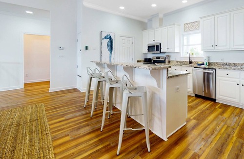 Sawgrass Pointe House | Inviting waterfront home with balcony, full kitchen, central AC, & W/D
