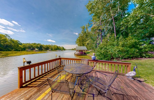 Sparta House | Inviting waterfront home with fireplace, dock, patio, central AC, & W/D
