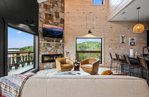 Sevierville Cabin | Lakefront home with retro accents, private pool, and private dock.