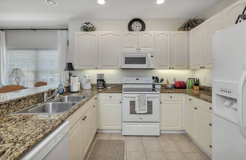 St. Simons Island Condo | Long distance marsh views and community pool.