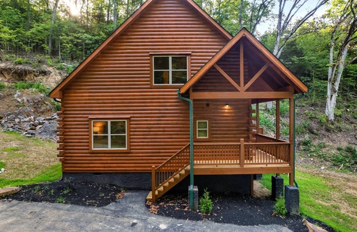 Sevierville Cabin | Modern Cabin with Hot Tub, Air Hockey, King Beds, Grill and Outdoor Pool!