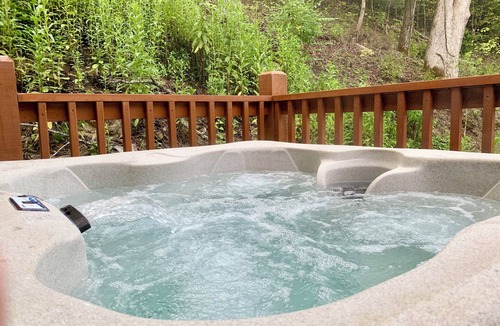 Sevierville Cabin | Modern Cabin with Hot Tub, Air Hockey, King Beds, Grill and Outdoor Pool!