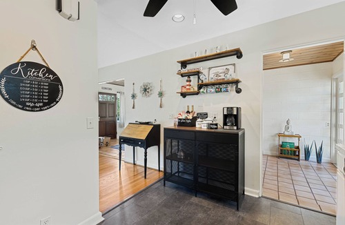 Mount Dora House | One home, fits two families, zero compromise. Dora's Dream splits into 2 private wings — each with its own 2 bedrooms, bath, and living room. Everyone gets togetherness and their own space. Just blocks from historic downtown Mount Dora and the lake.