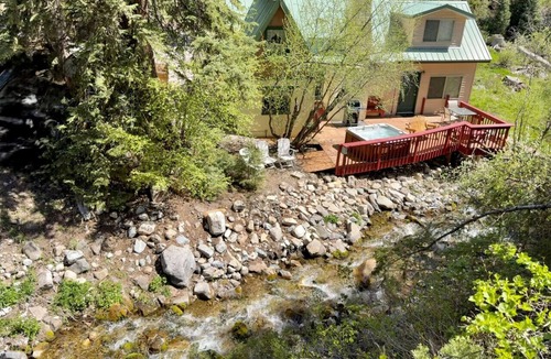 Sundance Cottage | Quiet streamside retreat Hot Tub Deck overlooking the creek Wood-burning Fireplace insert Tucked below Sundance