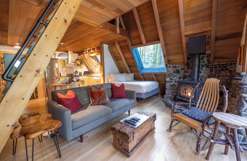 Baring Cabin | River Runs Through this secluded A-Frame, hot tub