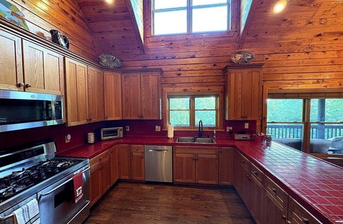 Mount Airy Cabin | Rustic Log Cabin with Hot Tub & Wraparound Porch in Mount Airy, North Carolina