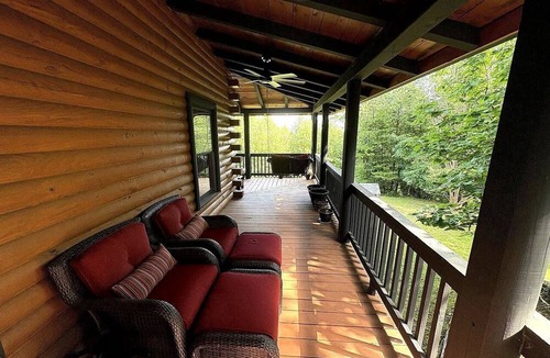 Mount Airy Cabin | Rustic Log Cabin with Hot Tub & Wraparound Porch in Mount Airy, North Carolina