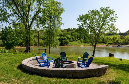 Dandridge Cabin | Serene lake views featuring a private dock, sun deck + spacious fire pit