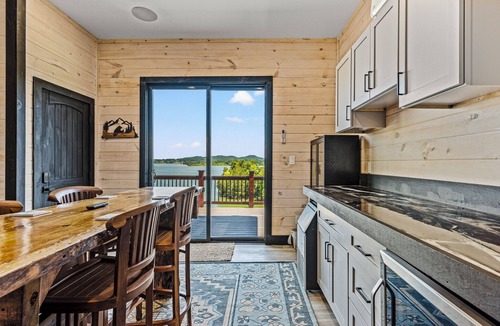 Sevierville Cabin | Stunning Mtn Lodge on Lake with two Story Dock, Indoor Pool, Arcade,and Hot Tub.
