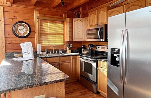 Jefferson Cabin | Waters Edge Riverfront Cabin | Hot Tub, Firepit & New River Views for the Whole Family
