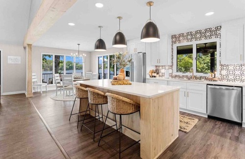 Mooresville Villa | Whiskey Sunsets: Stunning Peninsula Retreat with Panoramic Lake Views, Dock, Hot Tub, and More!