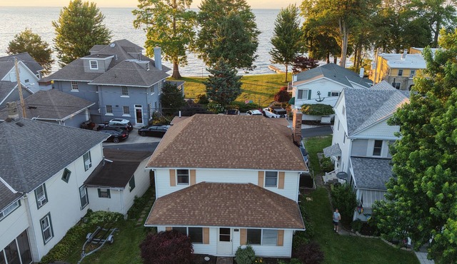4BR Lakefront Getaway! Sunset Views, Private Community Beach, Cozy Back Porch in Huron