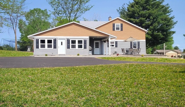 Bring the whole family to this great home with an acre of room for fun. in Dyersville