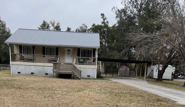 Charming 3-bedroom house nestled on Blythe Island with a fenced in back yard