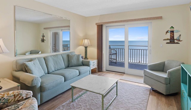 Direct oceanfront 2/2 with a private balcony, heated pool, and beach access