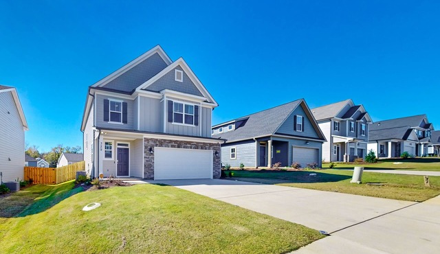 Newly constructed home in a quiet neighborhood with yard, modern interior, & W/D