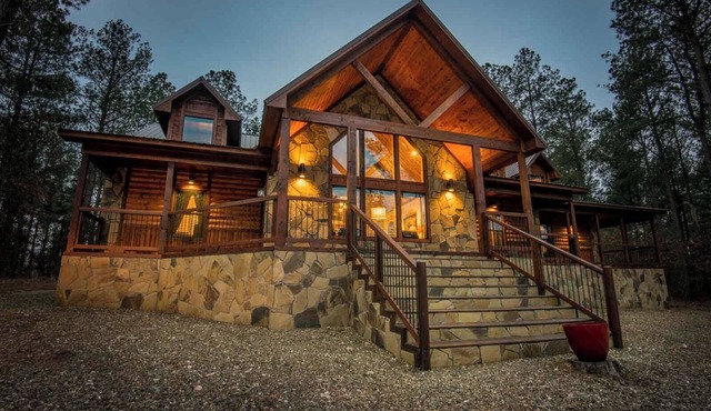 Soaring cathedral ceilings, gas rock fireplace, large hot tub, smart tv, games. in Broken Bow