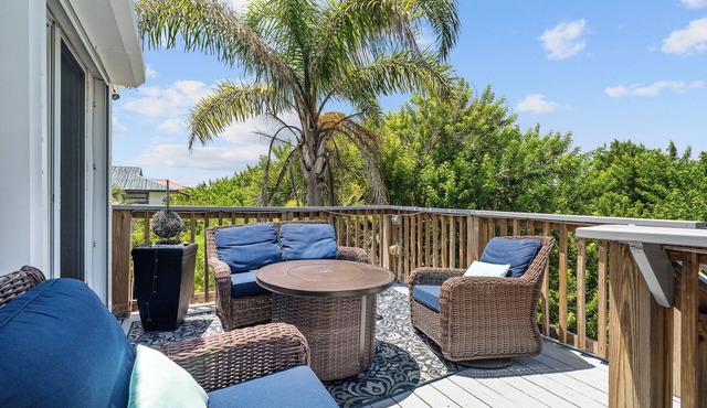 Spacious 3BR, 2BA beach home just a short walk from the sand! Three bedrooms up, private queen room and bath down. Secure 2-car garage for vehicles or a small boat. Perfect for families or groups. 30-day minimum stay required.