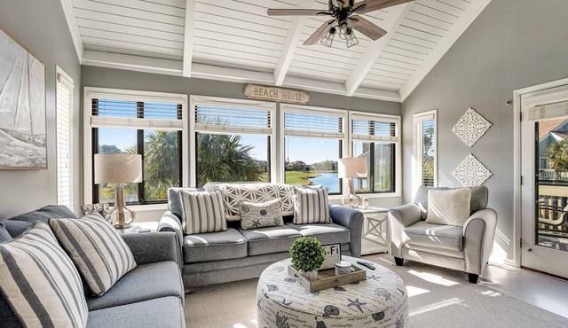 Stylish beach villa with three decks, and golf course views