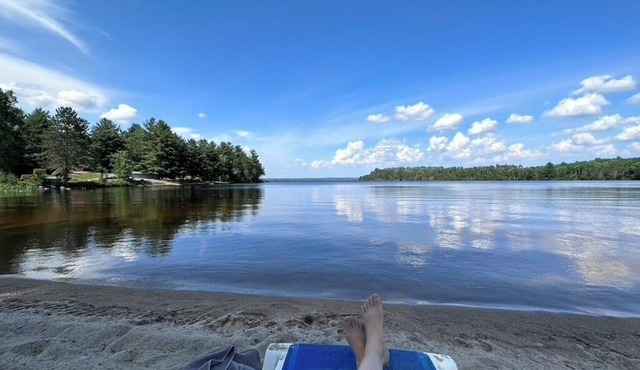 Timber Haven on the water's edge with your own private, sandy beach in Crystal Falls