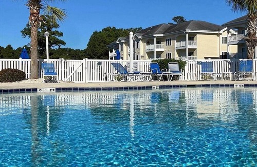 Central Myrtle Beach Condo | 1st Floor Unit W/Patio, Golf Course and Pool View, less than 10 Min to the Beach