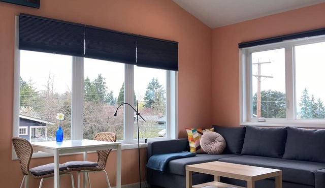 Colorful upstairs studio with lofted bed and soaking tub